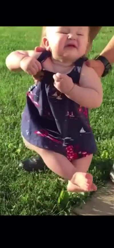 Golden reactions of babies touching the grass