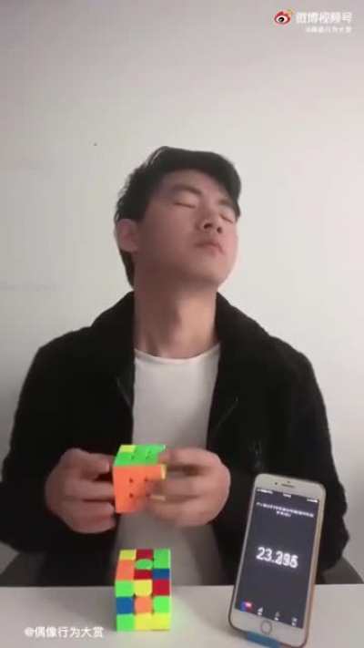 Man trying to solve a Rubik's Cube blindly, but in a different way