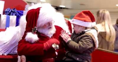 a mall santa signing for a deaf child
