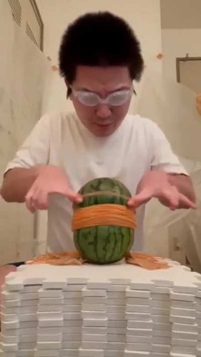 Playing with rubber band and watermelon