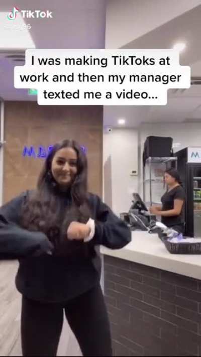 Girl making TikTok at work