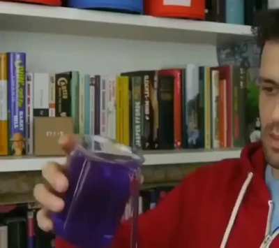 This is Polyethylene Oxide, which is also called "the liquid that spills itself". This happens because Polyethylene Oxide is a polymer, that is composed of especially long molecular chains that are tangled. That is why, once the liquid starts to drain, it