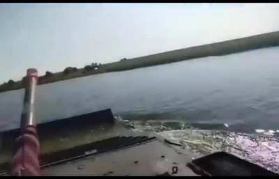 Ukrainians crossing a river