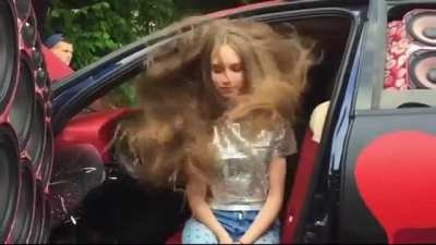 Bass makes her hair vibrate to the music