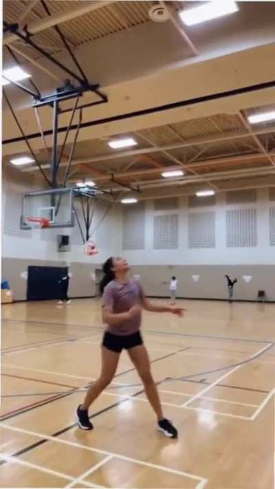 Just three girls doing a challenge with a ball.