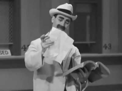 Groucho Marx gets conned out of his money by Chico with a Tutsi Frutsi Ice Cream cart, in their 1937 film "A Day at the Races". He sells him a tip on a horse, but Groucho has to keep buying book after book just to decipher it.