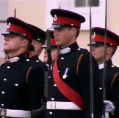 Queen pauses and smiles at William when she notices him