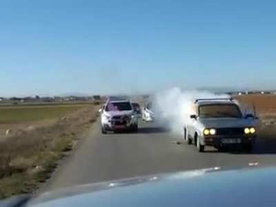 Lighting fireworks from a moving car.