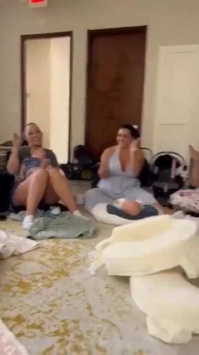 The moment when a group of new moms learn sign language to support another mom in their group.