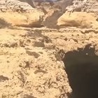 Guy jumps off cliff into tour boat.