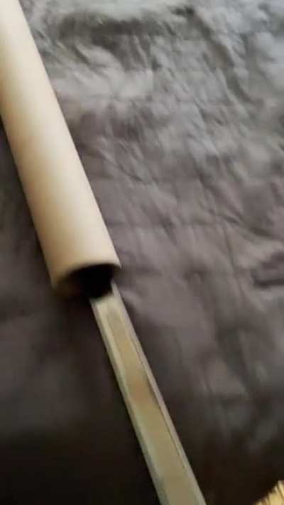 Are we showing cardboard tubes or swords? Is it legal to show both?