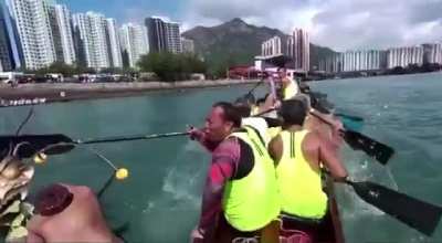 Participating in a dragon boat race.