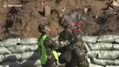 Military recruit drops a live grenade, but thanks to quick reflexes both lives were saved
