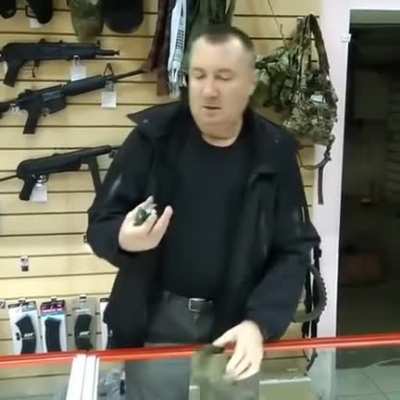 Russian man showing how to use a Grenade "safely"