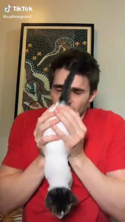 Man loves cat