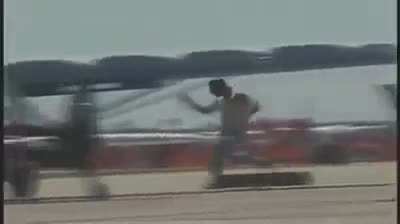 Trained stunt pilot performs "Drunken Plane Thief" act at Airshow