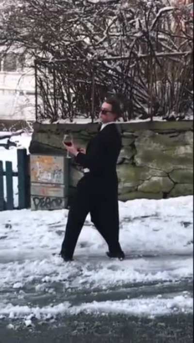 HMB, I will slide on ice, downhill, holding a cup of wine, calling someone and wearing a tuxedo tail suit and shades