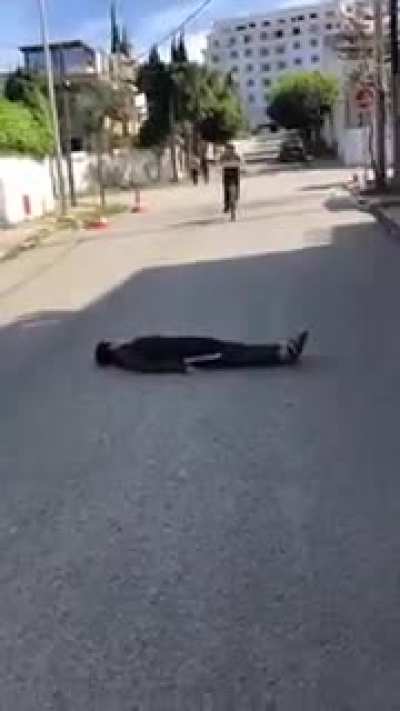 lie in front of a bicycle