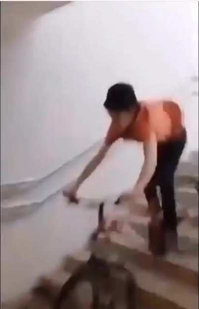 Riding a bike down the stairs into a Wall