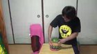 WCGW putting rubber band on watermelon