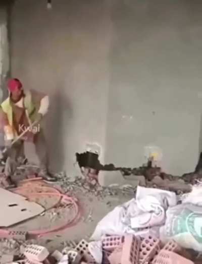 WCGW Walking in-front of a wall being hammered