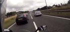 A motorcyclist speeding and weaving through traffic couldn’t stop in time, causing him to crash and fall between two moving semi trucks.