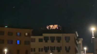 A dude with an electric guitar and an amp plays ‘We Are The Champions’ on his rooftop across Piazza Navona after Italy wins the Euro 2020
