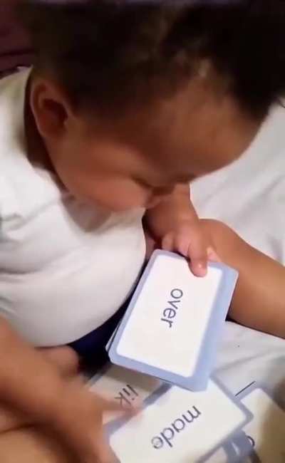 A baby reading