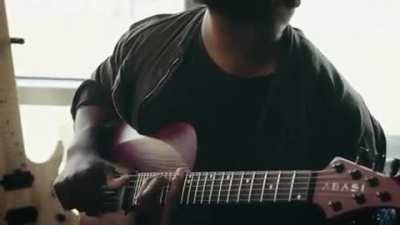 Tosin Abasi showing off his "thumping" technique