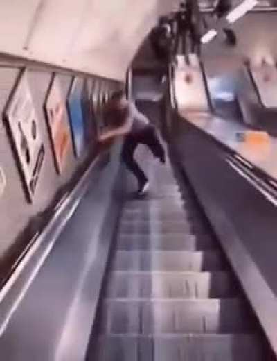 At looking cool going down the escalator