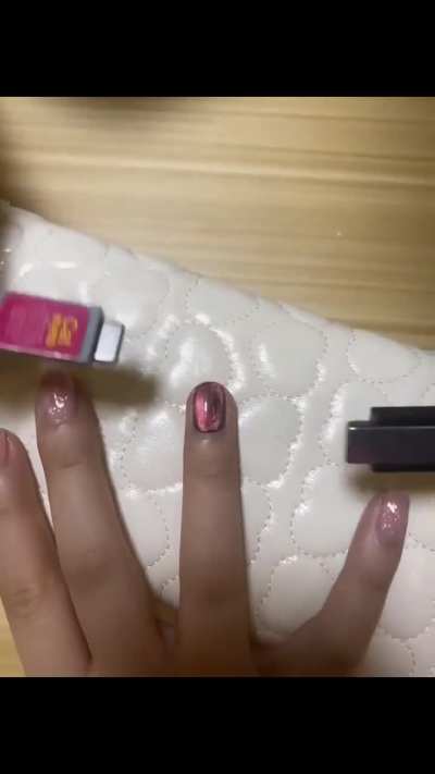 There are tiny magnet particules in the nail polish and when it's wet, it can be reshaped with a magnet