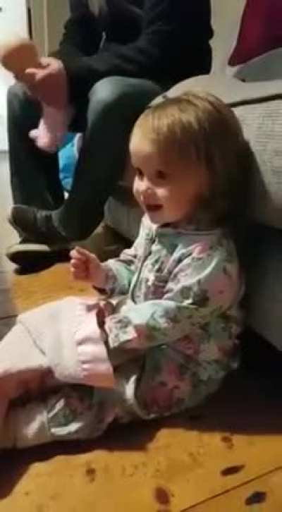 Dad and daughter cheering on their team