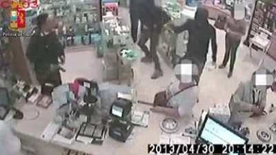 To rob a store, with an on-duty officer present.