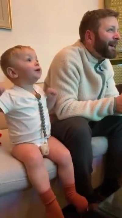 Watching the game with dad.