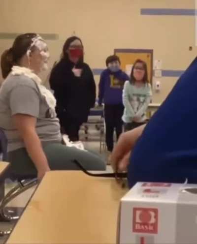 Teacher tries to raise money for the new library... ends up with a broken nose and a concussion. ?