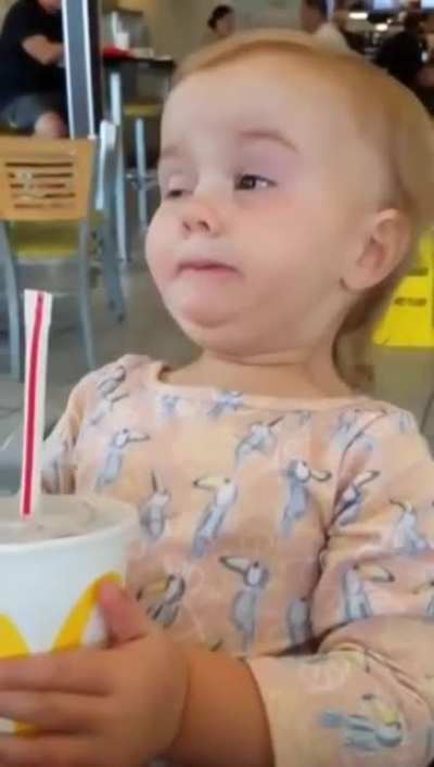 Little girl tries cola for the first time