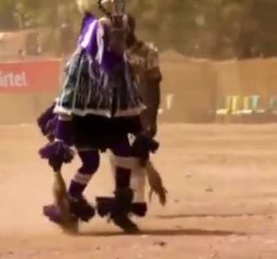 This dance is called "Zaouli" from the central Ivory Coast.