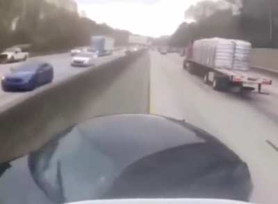 Car cuts off semi truck and causes it to flip over onto it a a