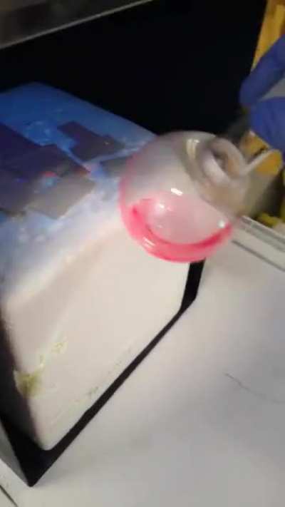 Red fluorescence from a blue dye