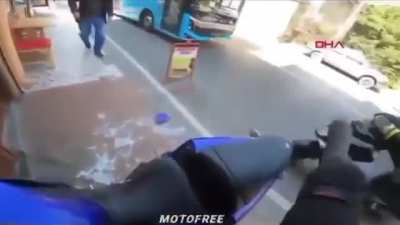 Motorcyclist goes through window