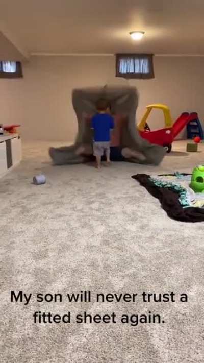 The way this dad "eats" his son with the fitted sheet