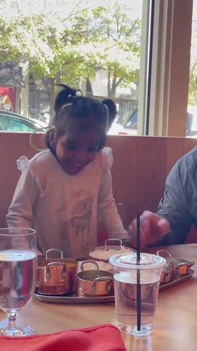 She is an adoptee from India and can't contain herself seeing her national food