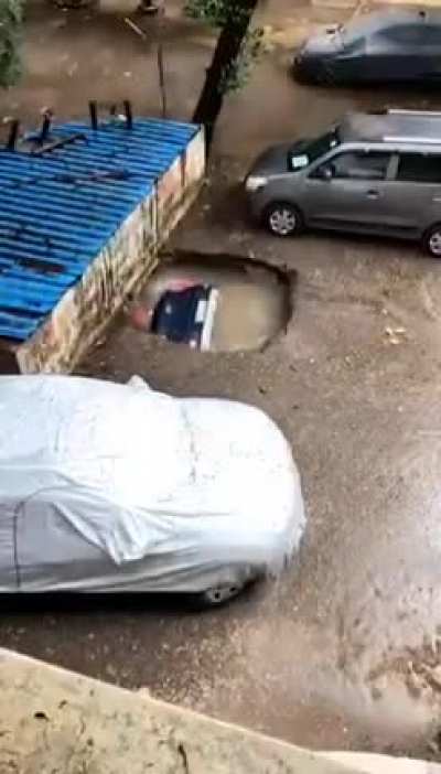 Car swallowed completely by a sinkhole in residential complex in Mumbai (India ). Later discovered that it was a covered well under a parking lot!