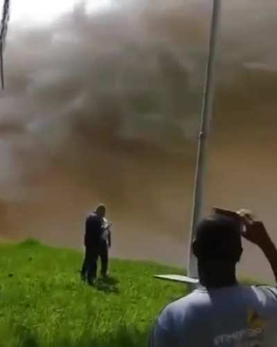 Releasing surplus water from a hydroelectric power plant in Brazil