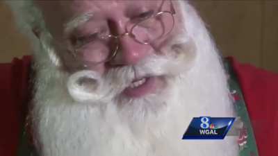 Santa comforting a dieing cancer patient ? ?