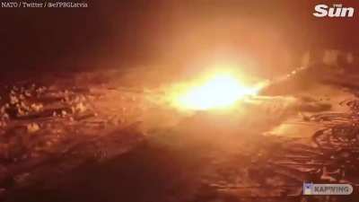 25 tanks representing all NATO nations firing at once during an exercise