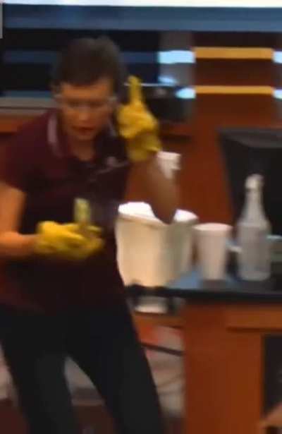 Tatiana Erukhimova, professor of physics and astronomy at Texas A&amp;M University, conducts physics experiments for a group of children on how to build a house out of wood, nails and frozen bananas.