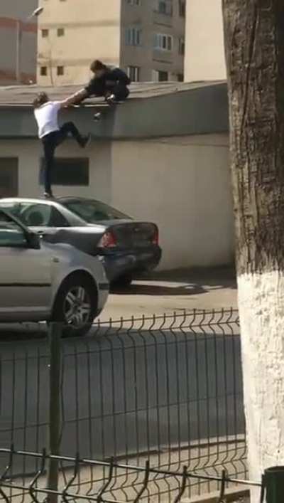 Win stupid prize by trying to help a friend to get to the roof...