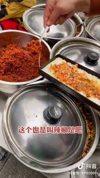 "Bandit guoba" (scorched rice) for only 5 yuan ($0.70 USD), Chongqing. Includes fermented bean curd, pickled chili, pickled radish, chameleon plant (houttuynia cordata), peanuts