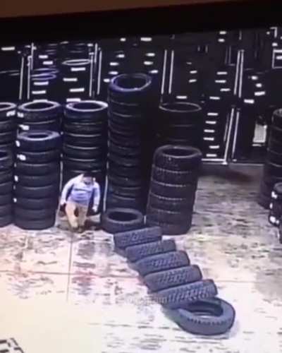 pushing over tall stack of tires